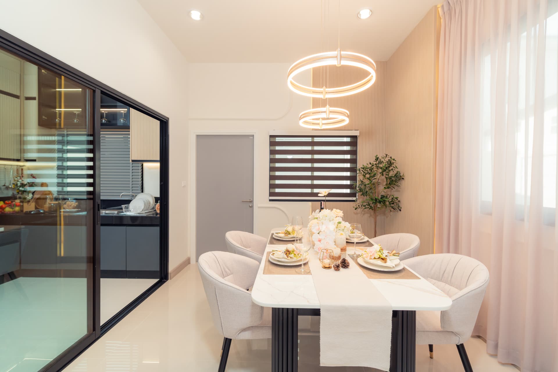 K Avenue II — dining room with a black-framed glass kitchen partition