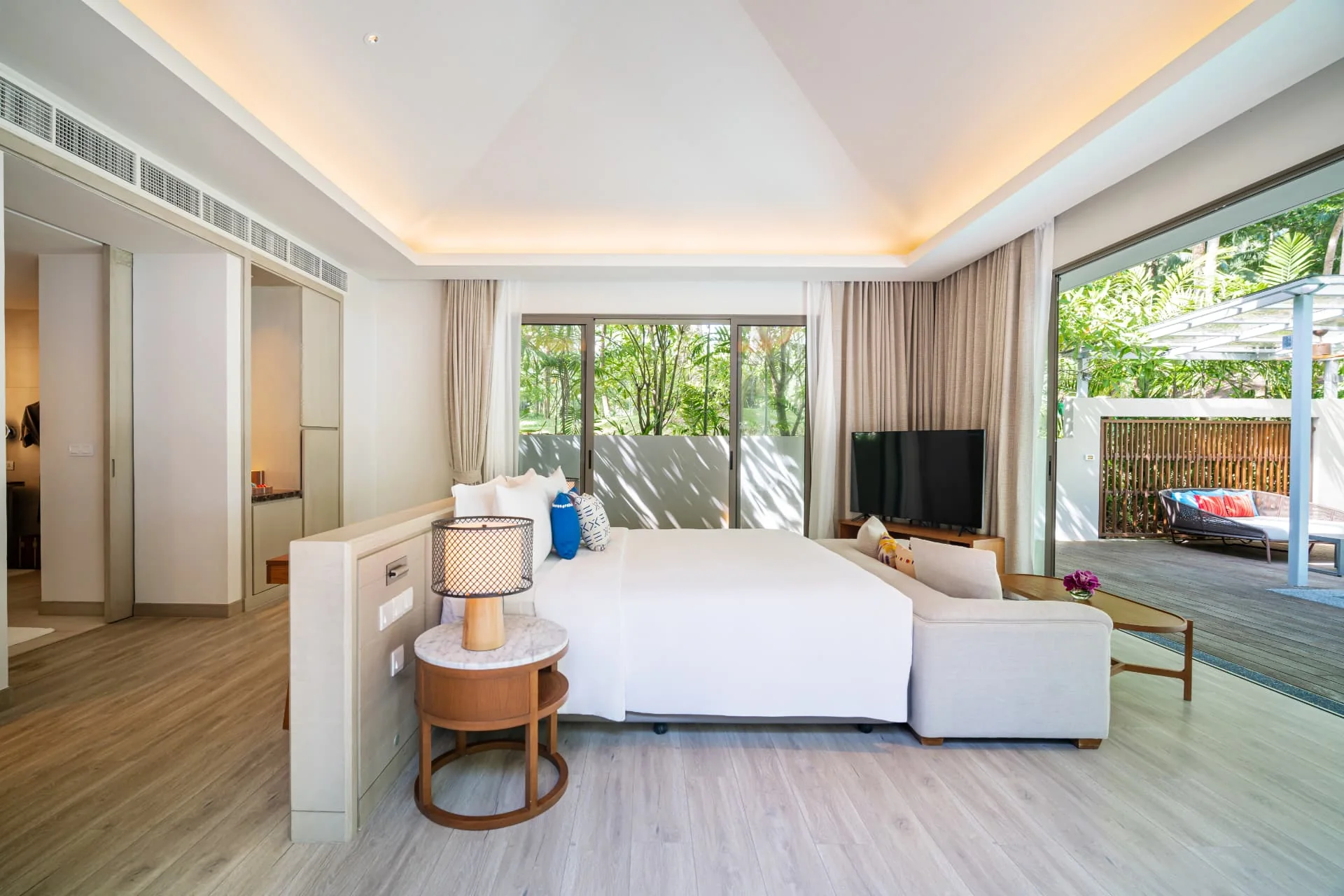 AVANI+ KAO LAK — Bedroom with a garden view and bedside lighting