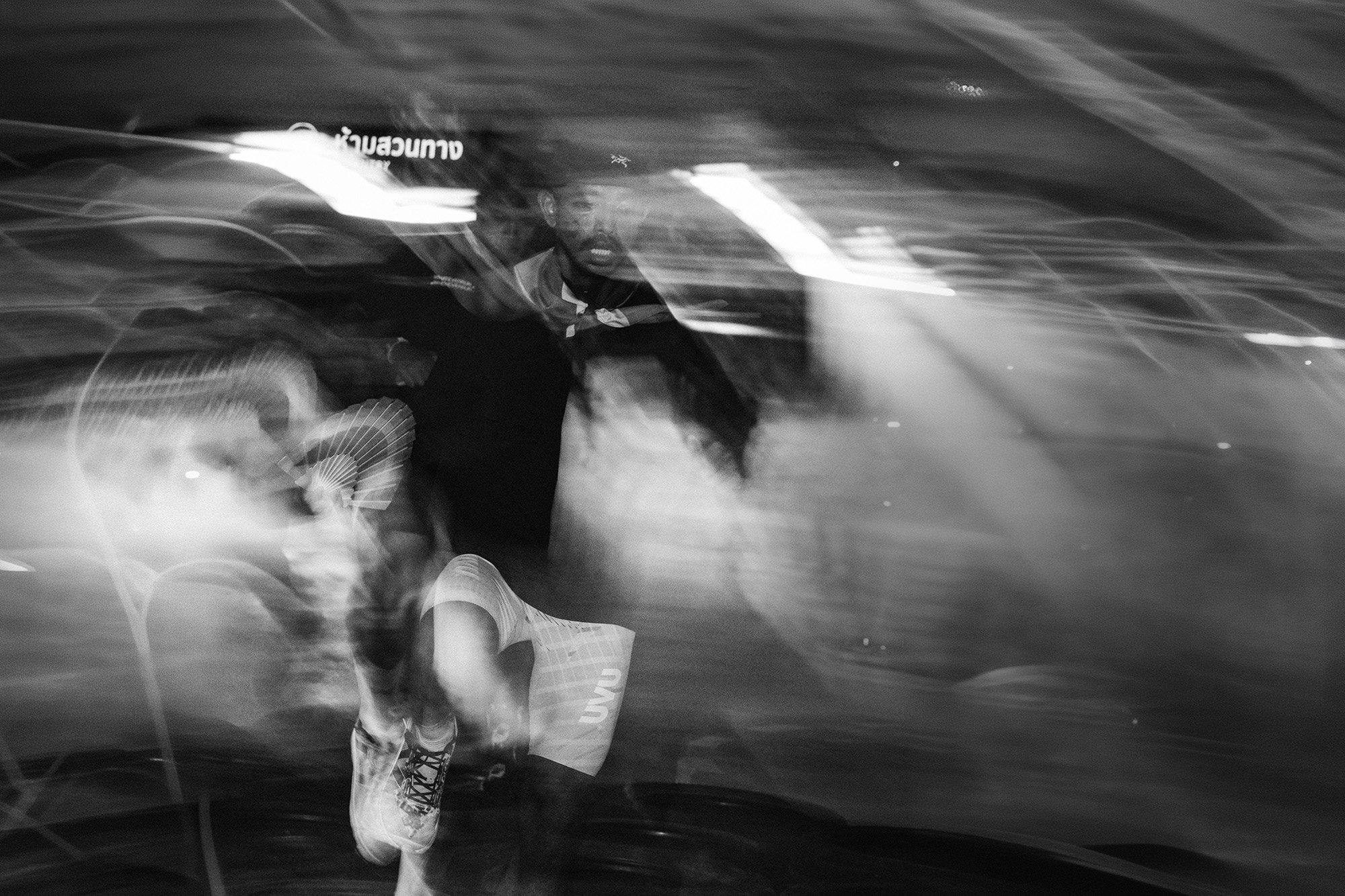 Central Phuket Beyond Move — runner in motion, black and white with sweeping light trails