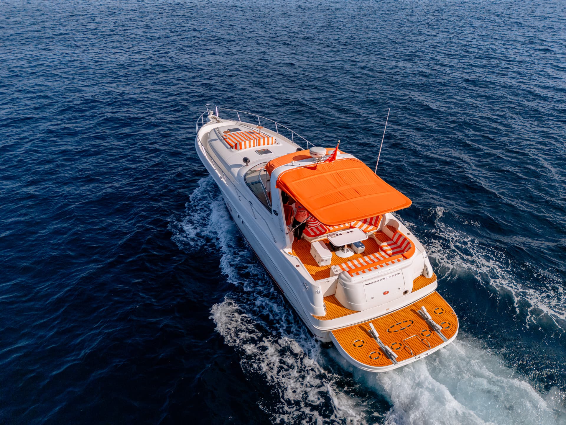 Once Yachting — aerial rear view of the stern and open cockpit trailing a wake