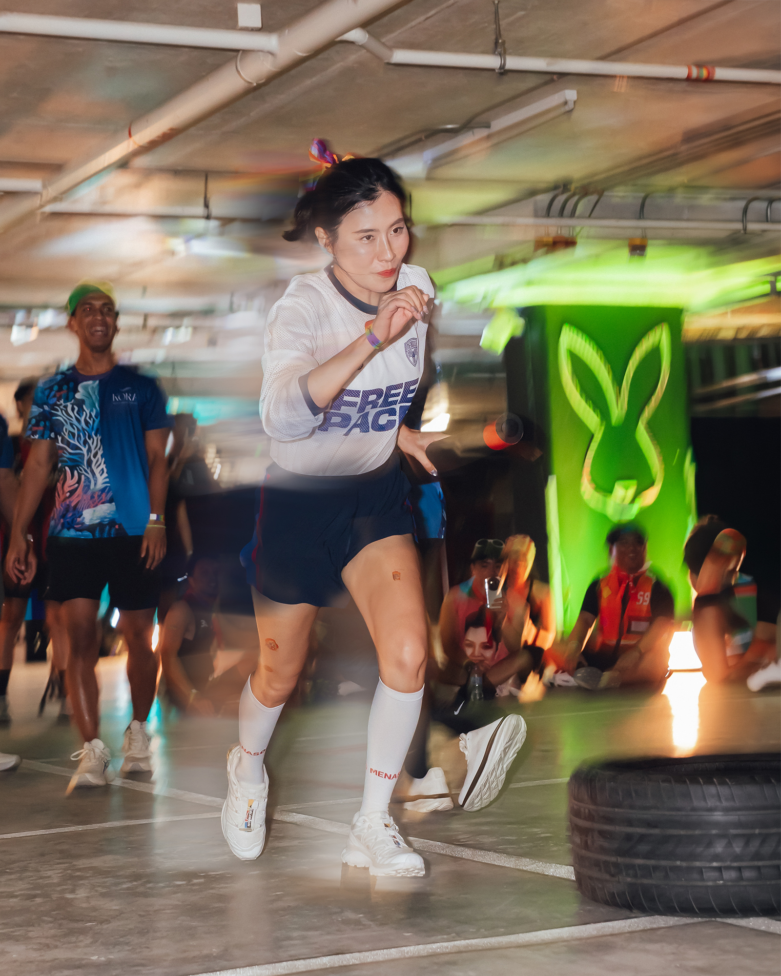 Central Phuket Beyond Move — Free The Pace runner pushing through a green-lit car park course
