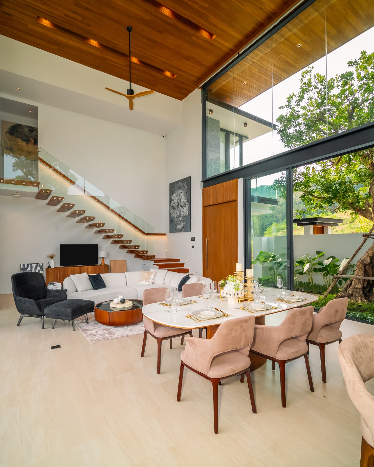 Botanica Foresta II — vertical view of the living room with a floating staircase and garden glazing