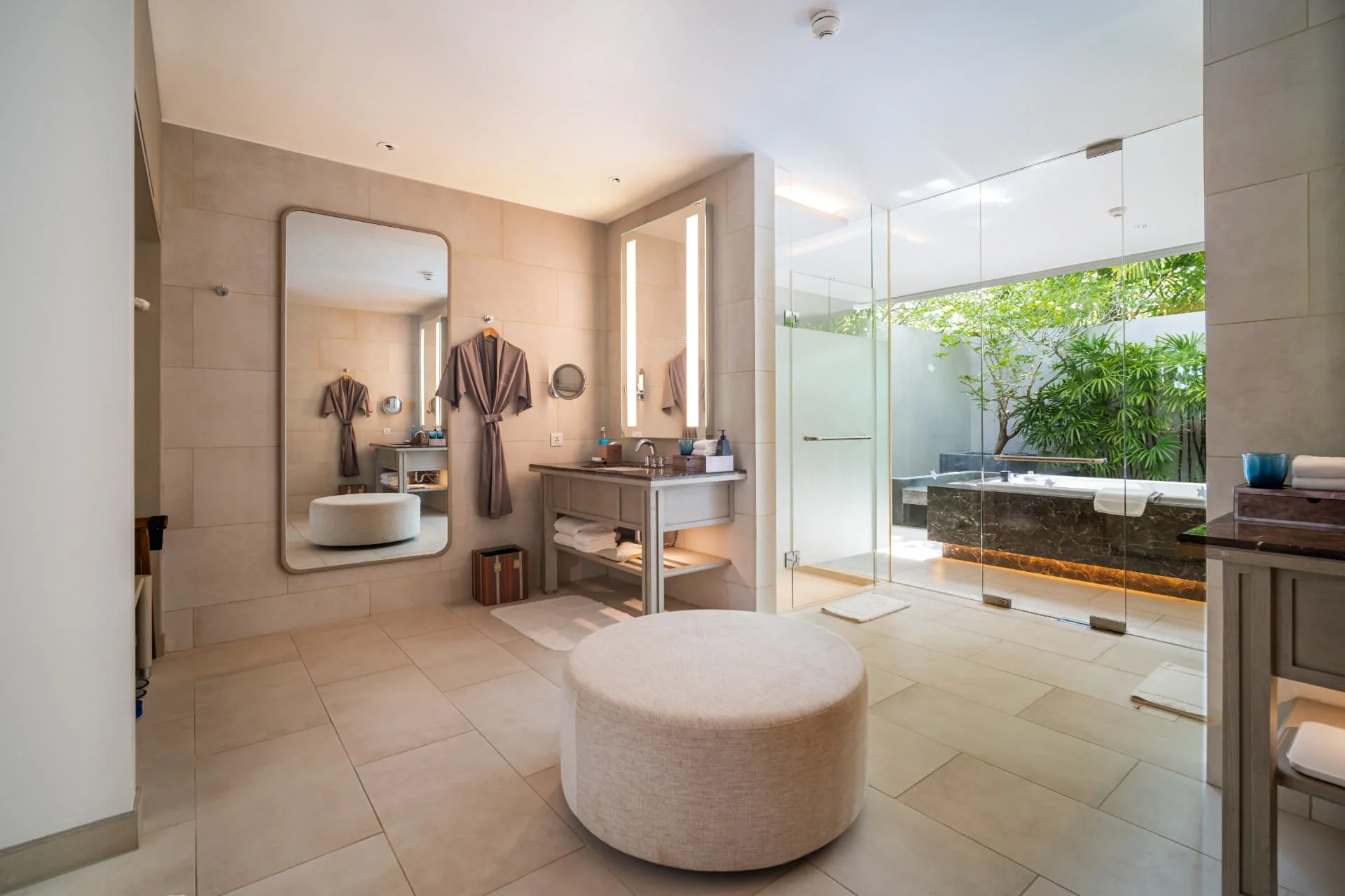 AVANI+ KAO LAK — Bathroom with a freestanding bathtub and garden window